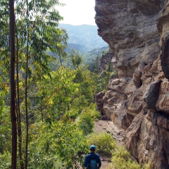 Walking along the base of a wall in Macheta